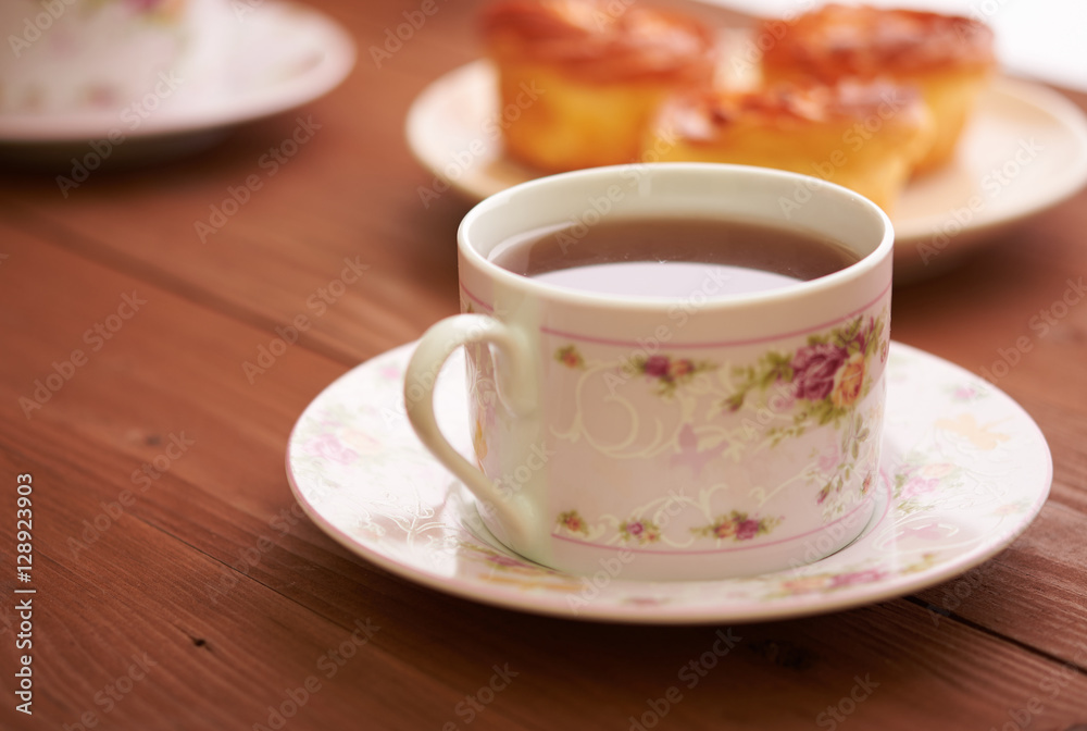 tea and sweets on a wooden table tea and sweets on a wooden table