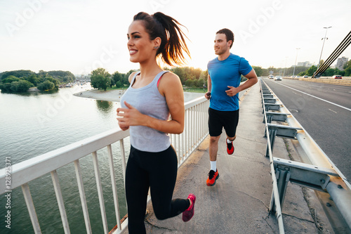 Athletic couple jogging together