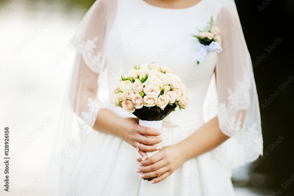 young bride with bouquet of white roses young bride with bouquet of white roses