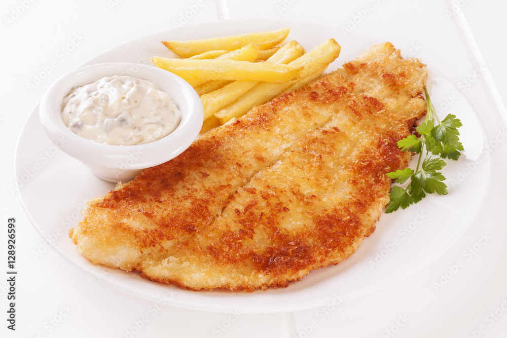 Breaded fish with tartare sauce and chips. Breaded fish with tartare sauce and chips.