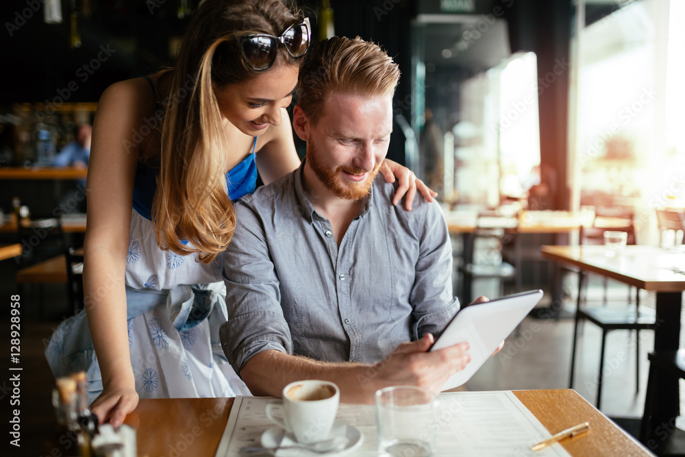 Beautiful couple looking at tablet Beautiful couple looking at tablet