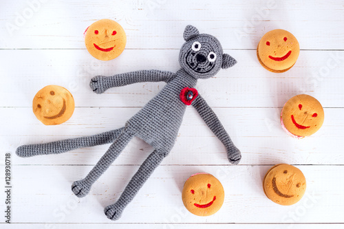 Handmade crochet cat toy with macarons.