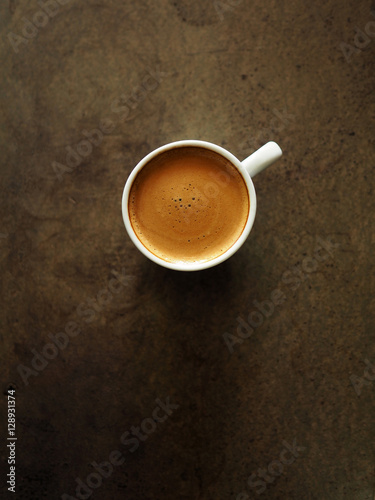 Cup of hot espresso coffee on wood table, black coffee from arab