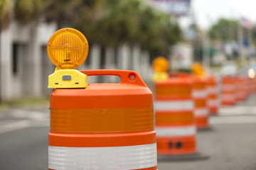 Road closed signs detour traffic temporary barrel arrow light