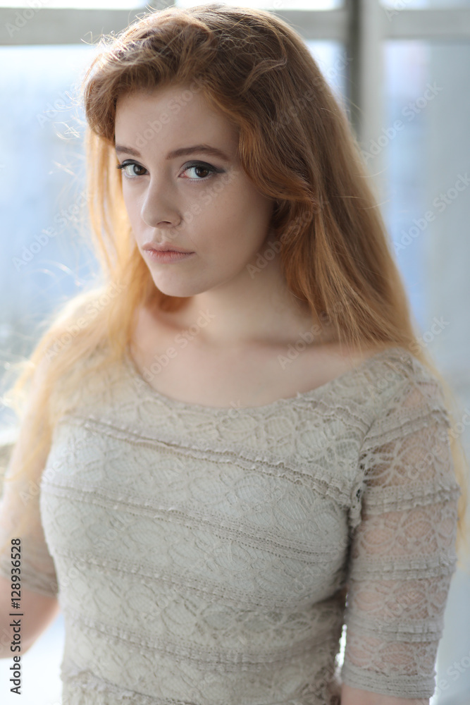 Red Haired Woman in Beige Dress