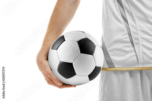 Professional football player holding ball on white background, closeup