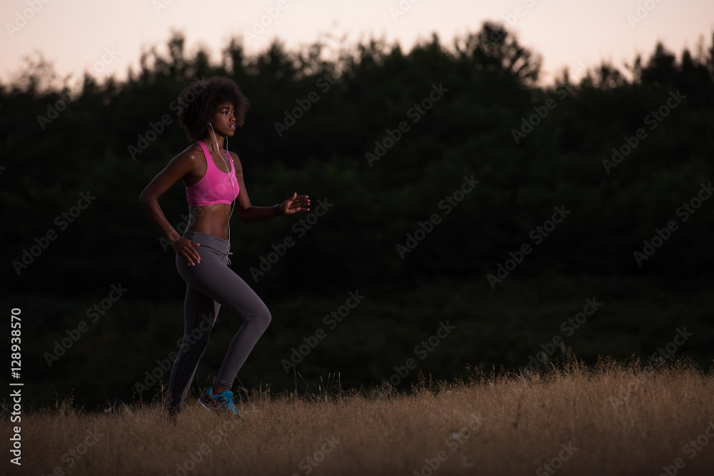 Young African american woman jogging in nature Young African american woman jogging in nature
