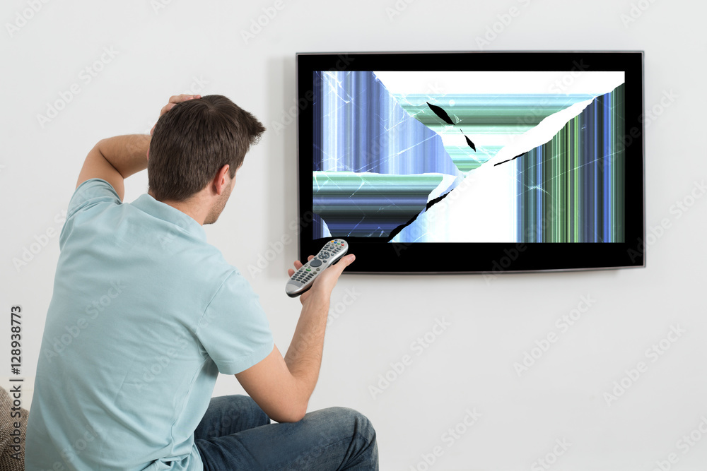 Man In Front Of Television Showing Distorted Screen Stock Photo Adobe Stock