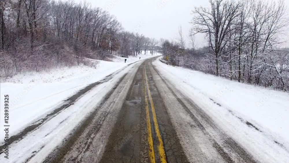 Rise above slippery roads and bad weather conditions. The viewer first drives down a slippery, icy winter road. Then the viewer is literally lifted up above it all. Rise above slippery roads and bad weather conditions. The viewer first drives down a slippery, icy winter road. Then the viewer is literally lifted up above it all.