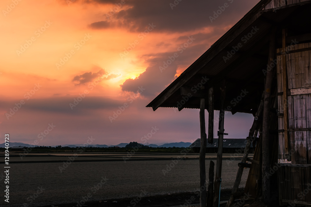 Beautiful landscape at sunset salt Farm. Salt Farm is the place with so much sea-salt production in the country, Thailand.