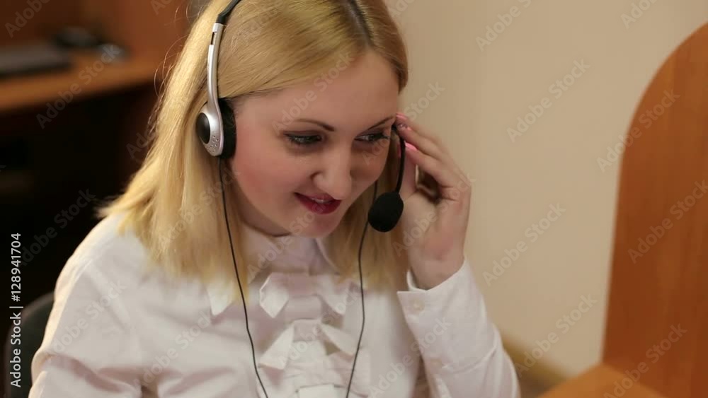 Attractive young girl working in a call center.