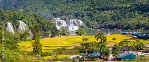 Bangioc waterfall in Caobang, Vietnam - The waterfalls are located in an area of mature karst formations were the original limestone bedrock layers are being eroded. photo