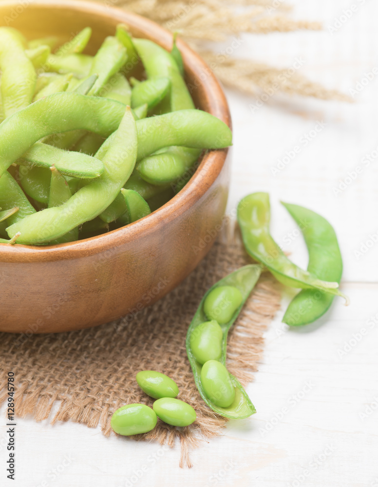 Green Japanese Soybean in wooden bowl on table wood Green Japanese Soybean in wooden bowl on table wood