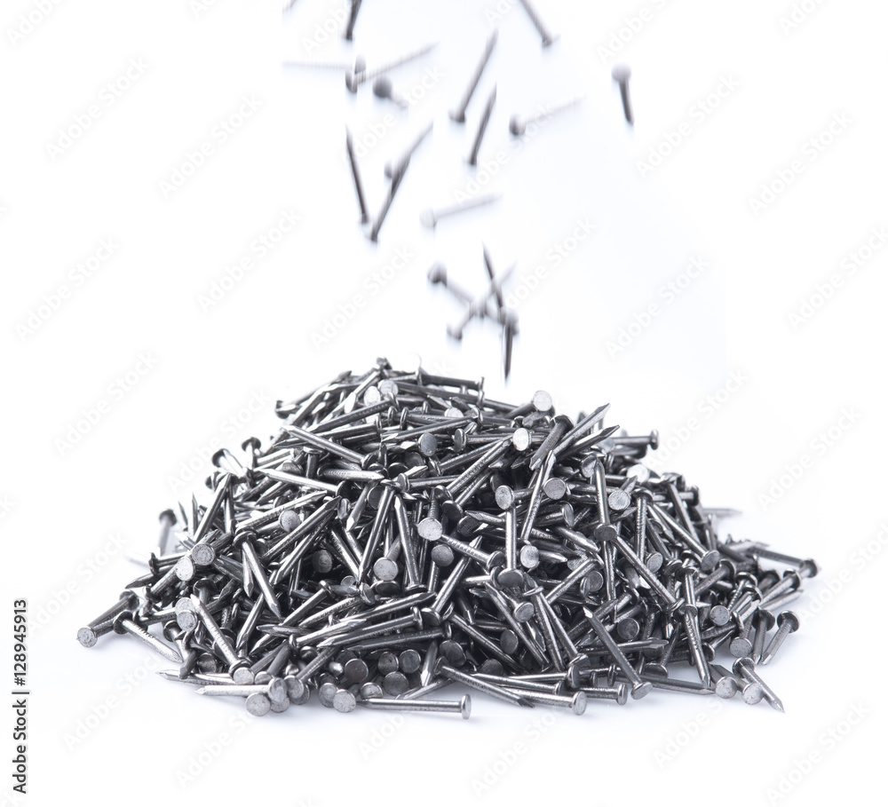 pile of metal nails on a white background