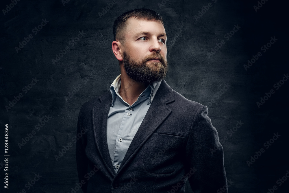 A bearded middle age male dressed in a woolen suit A bearded middle age male dressed in a woolen suit
