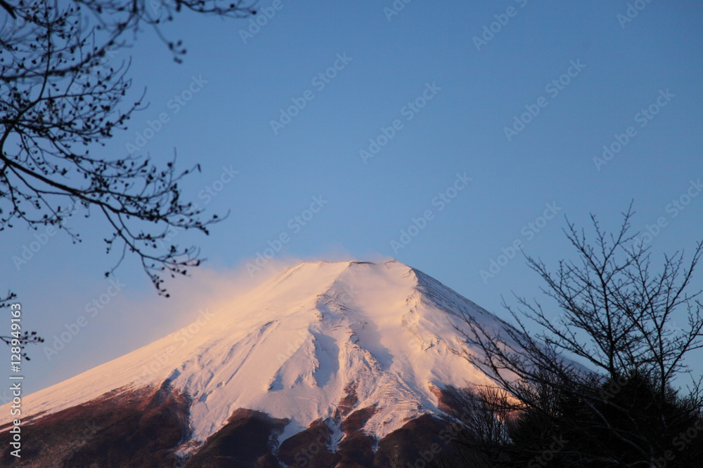 Snow on top of Mt.Fuji with lights of sunrise.