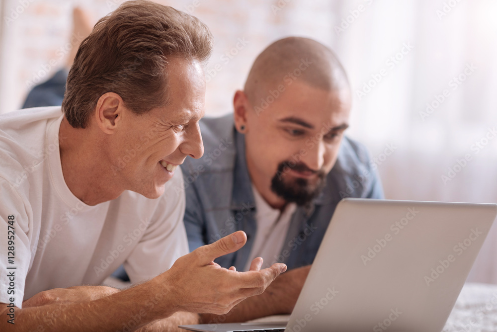 Involved friends surfing the Internet at home Involved friends surfing the Internet at home
