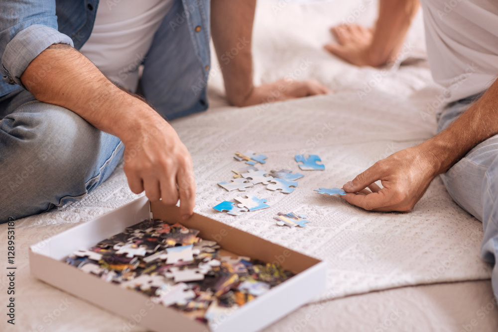 Small box with puzzles lying on the bed Small box with puzzles lying on the bed