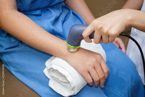 Ultrasound in physical therapy - Therapist using ultrasound to t