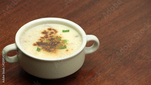 Sweet Apple Cream Soup with Cinnamon on Wooden Table