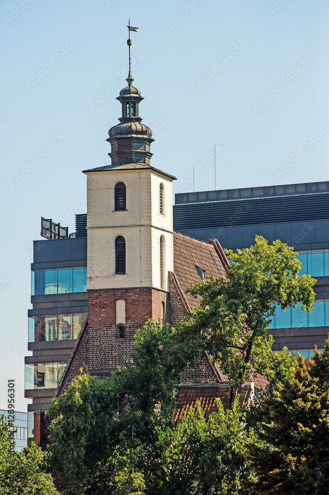 old and new architecture in Wroclaw city. View on tower of St. Christopher Church. Poland
