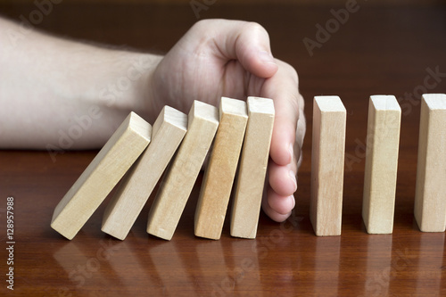 Stop domino risk effect photo
