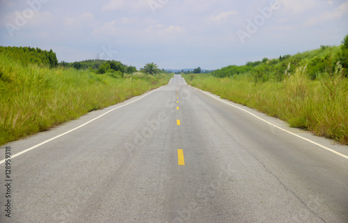 Stock Photo .Empty blur asphalt road and sunlight and sign which