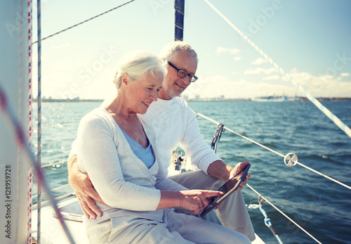 senior couple with tablet pc on sail boat or yacht © Syda Productions