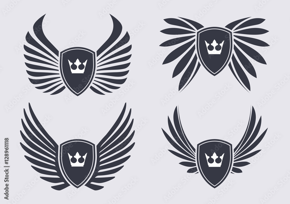 Fototapeta premium Set of 4 pair of stylish decorative vector wings with shields an