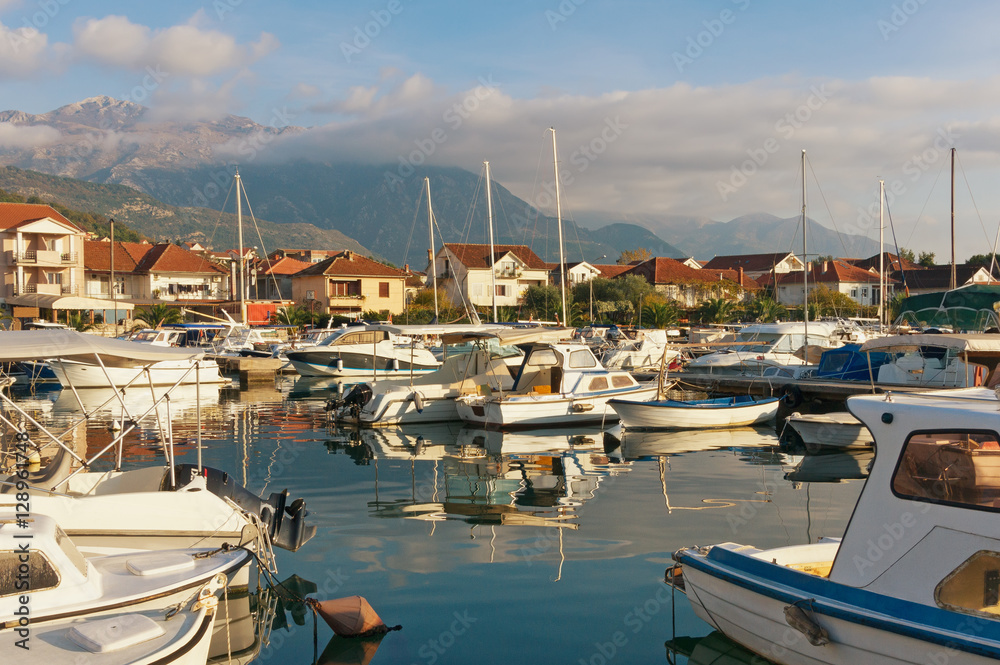 View of boat harbor in Tivat city with Lovcen mountain in the background. Montenegro