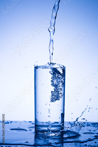 Water in a glass on acrylic background