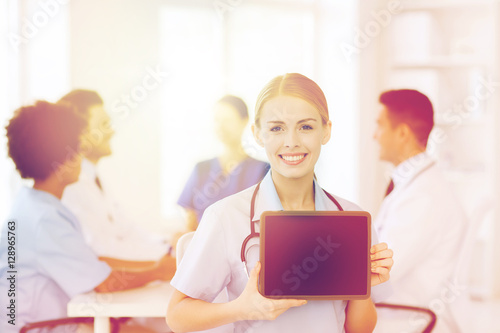 happy doctor over group of medics at hospital