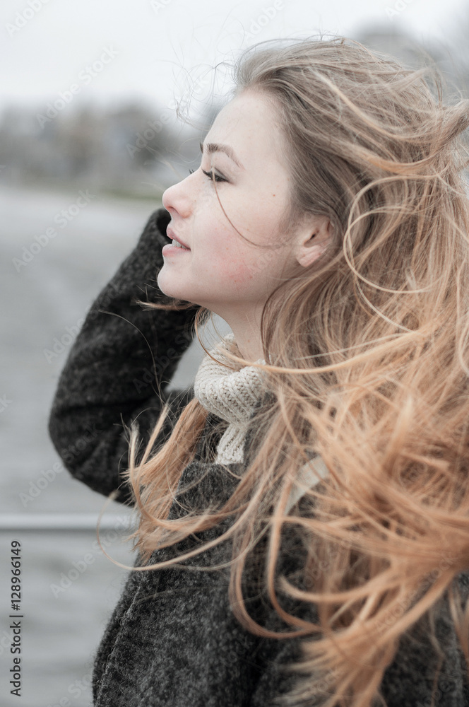 Girl with hair blowing in the wind