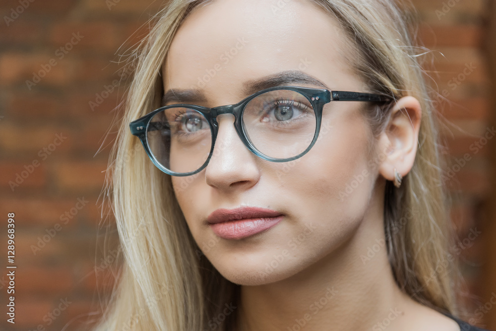 young business woman blonde in glasses in cafe young business woman blonde in glasses in cafe