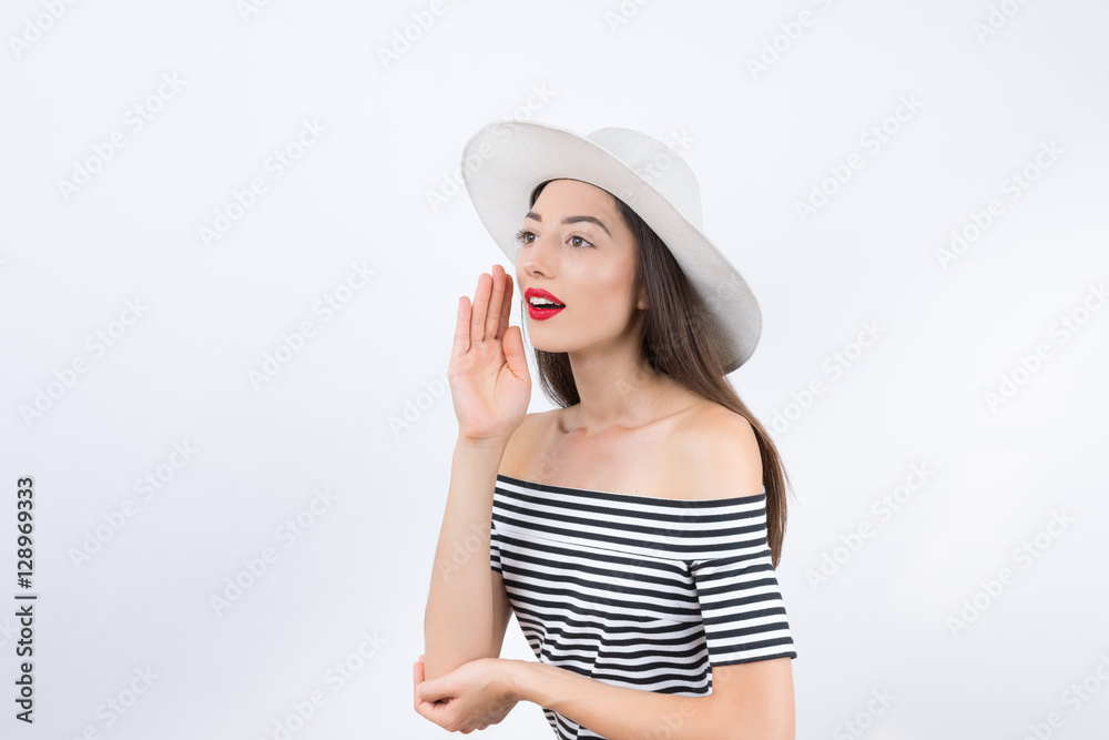 Shouting young woman in dress posing with hand on chin. Three qu Shouting young woman in dress posing with hand on chin. Three qu