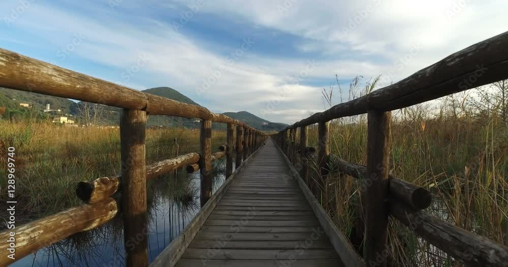 Massaciuccoli Pond with the wooden bridge Massaciuccoli Pond with the wooden bridge