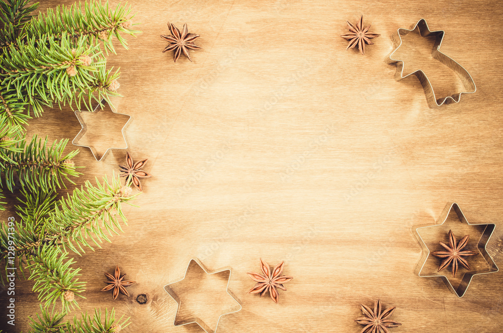 Culinary background. Cutters for cookie, anise and branch of Christmas tree.