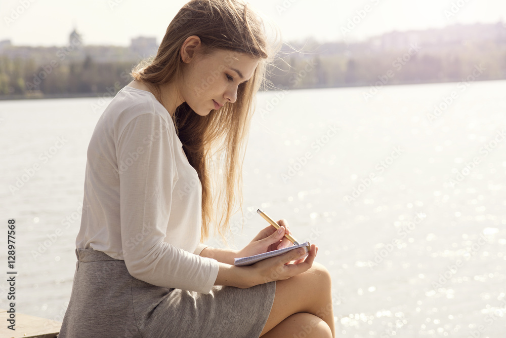 woman drawing on the park. woman drawing on the park.