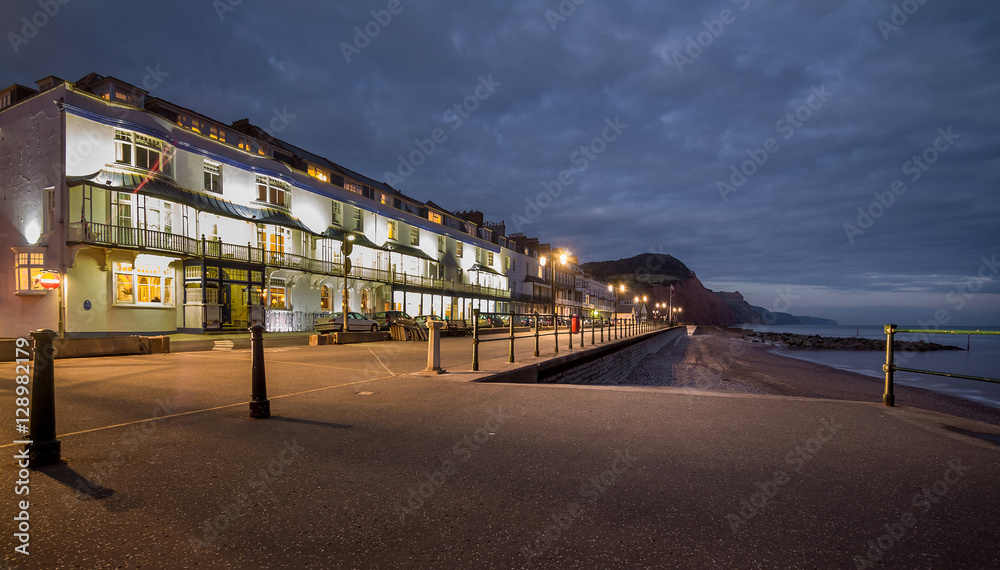 night view of the first coastline in the town of Sidmouth. Backlight. England, Devon