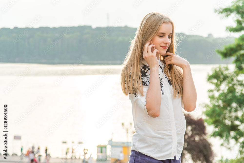 Young pretty beautiful woman girl talking on mobile phone. Young pretty beautiful woman girl talking on mobile phone.