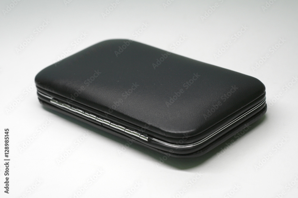 Black small imitation leather cases on white background
Black small imitation leather cases on white background