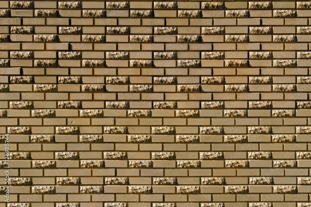 Brick wall made of light yellow facing bricks Brick wall made of light yellow facing bricks