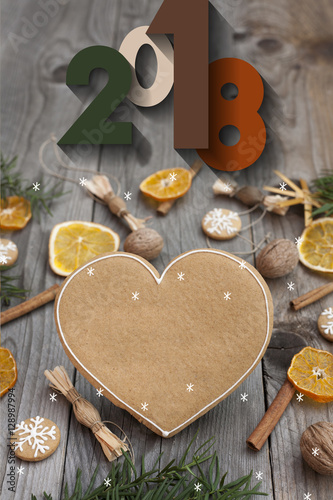 Christmas heart shaped gingerbread background. Winter holidays atmosphere. Snoflakes. Greeting card for Christmas and New Year`s Eve holiday 2018.Winter holiday poster.
