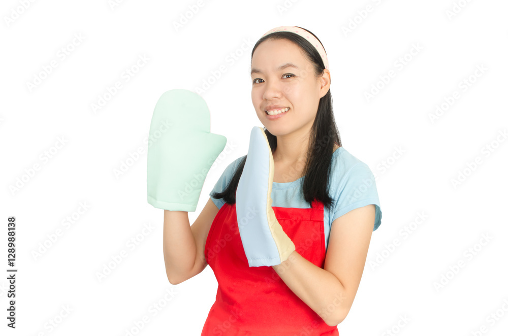 Young Asian woman wearing red apron and oven mittens ready to cooking or baking,isolated on white background Young Asian woman wearing red apron and oven mittens ready to cooking or baking,isolated on white background