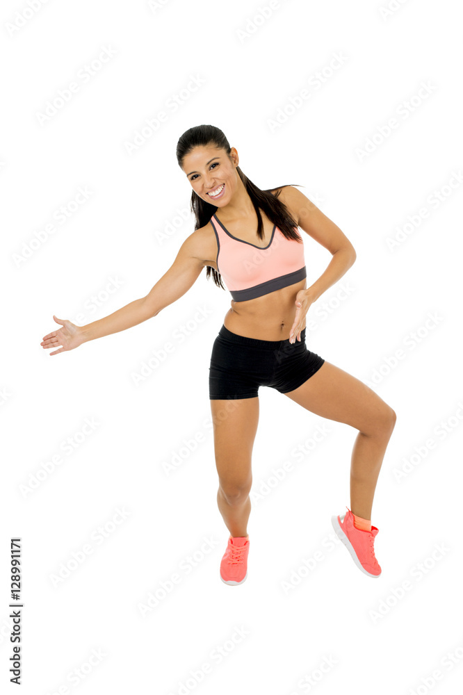young beautiful latin woman in fitness clothes dancing zumba in aerobic workout happy and excited