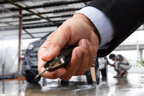 Hand with car key