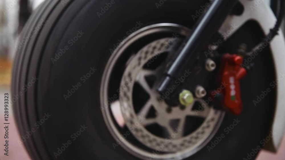 rotating wheels of the bike, closeup rotating wheels of the bike, closeup