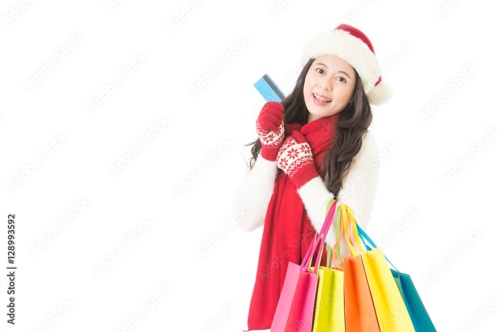 woman holding credit card for winter christmas shopping woman holding credit card for winter christmas shopping