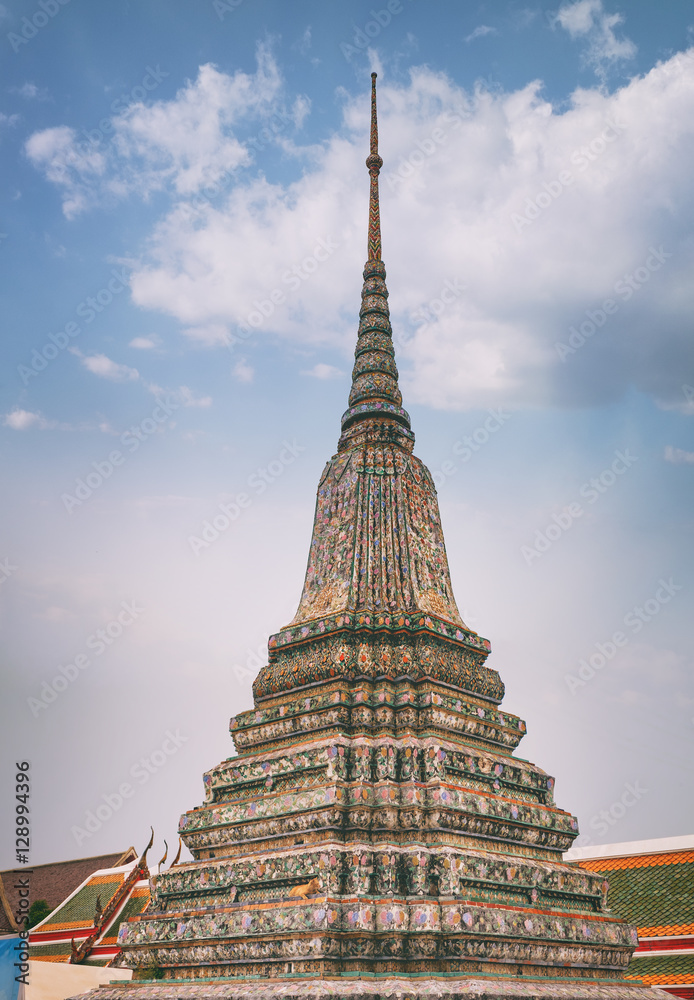 Stupa-like pagoda encrusted with coloured faience in Temple of Dawn, Wat Arun, Bangkok, Thailand.