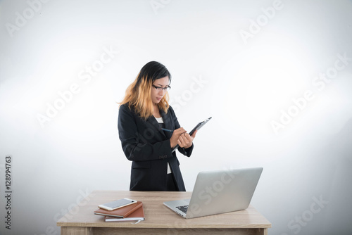 Young business woman with laptop notebook and smartphone in the
